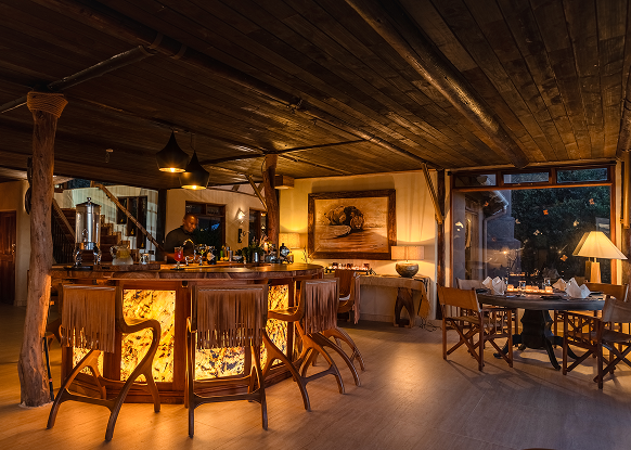 Circular marble bar glowing warmly in the evening light.