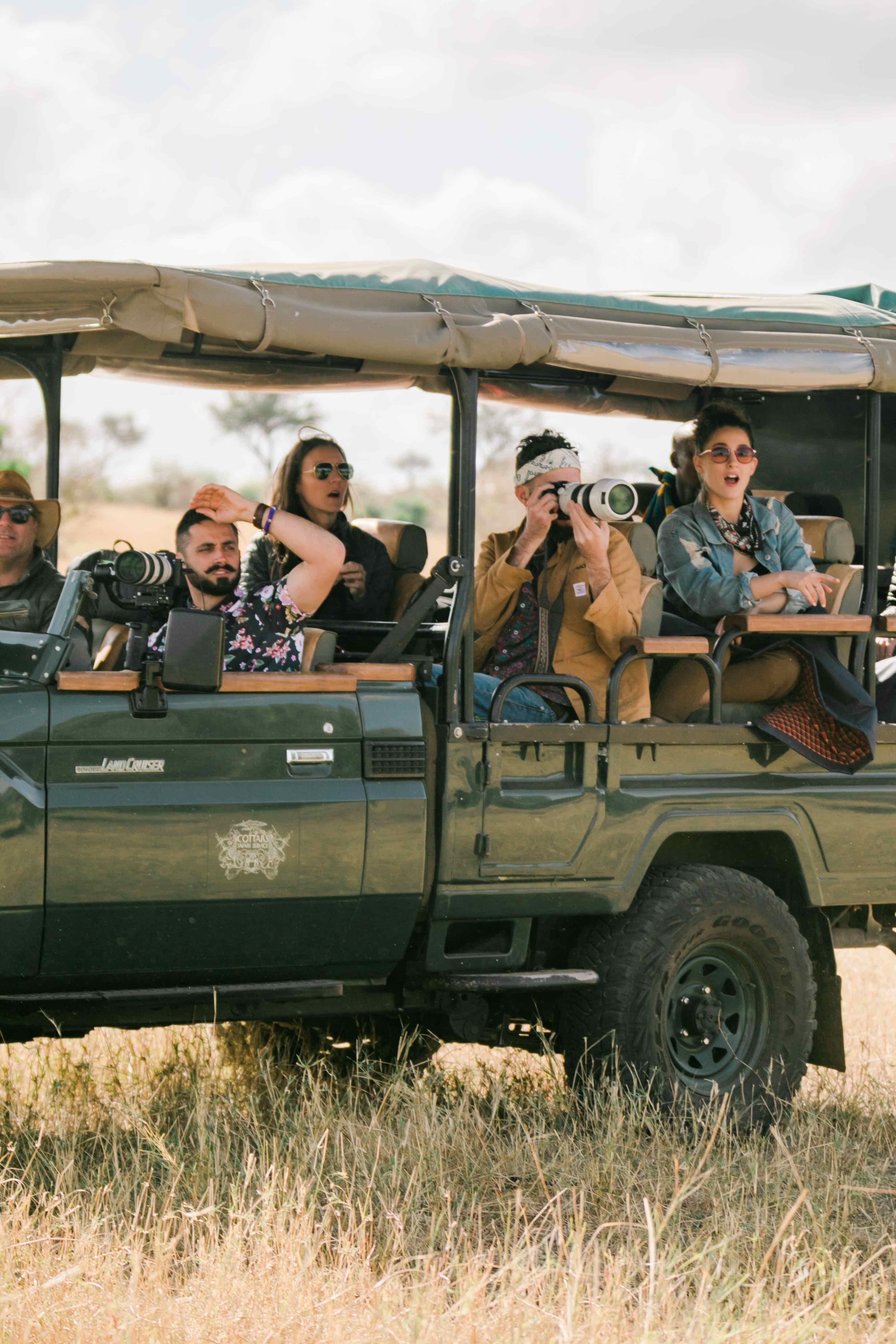 Photographer capturing wildlife with a telephoto lens.