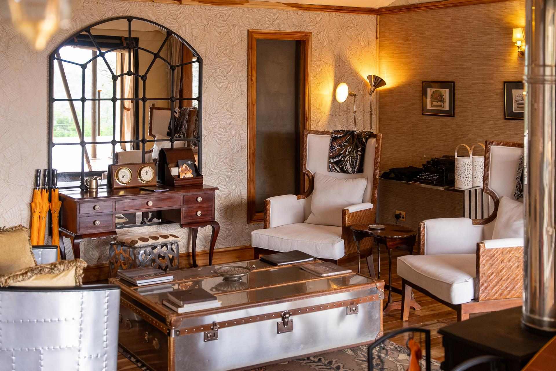 Tana Family Tent Interior Tana Family Tent at Cottar’s 1920s Camp with spacious lounge, two en-suite bedrooms, and a warm beige-silver palette accented with antiques.