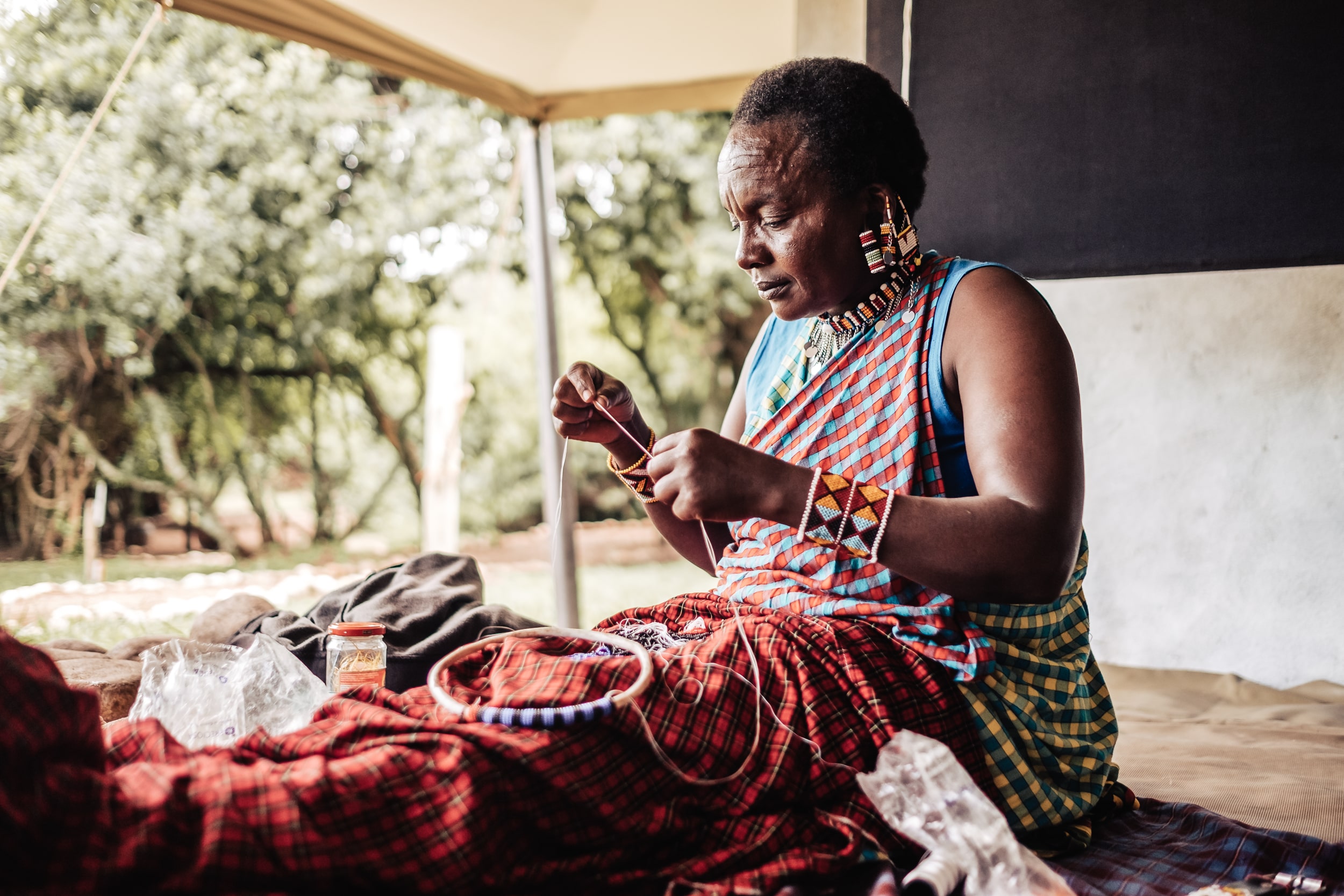 Maasai artisan handcrafting traditional beaded jewellery at Cottar’s 1920s Camp.