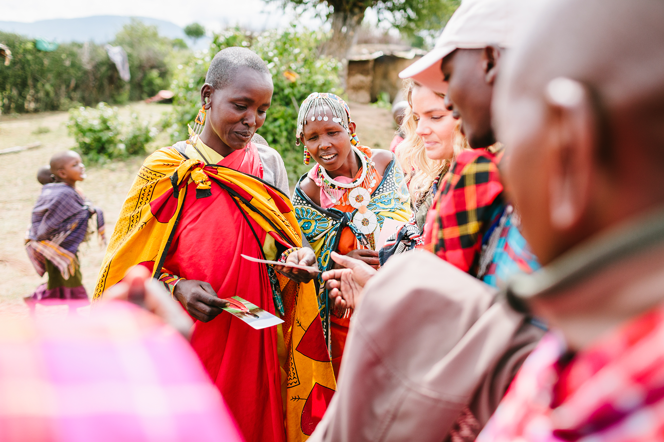 Guests learning about Maasai culture during a community visit in Kenya.