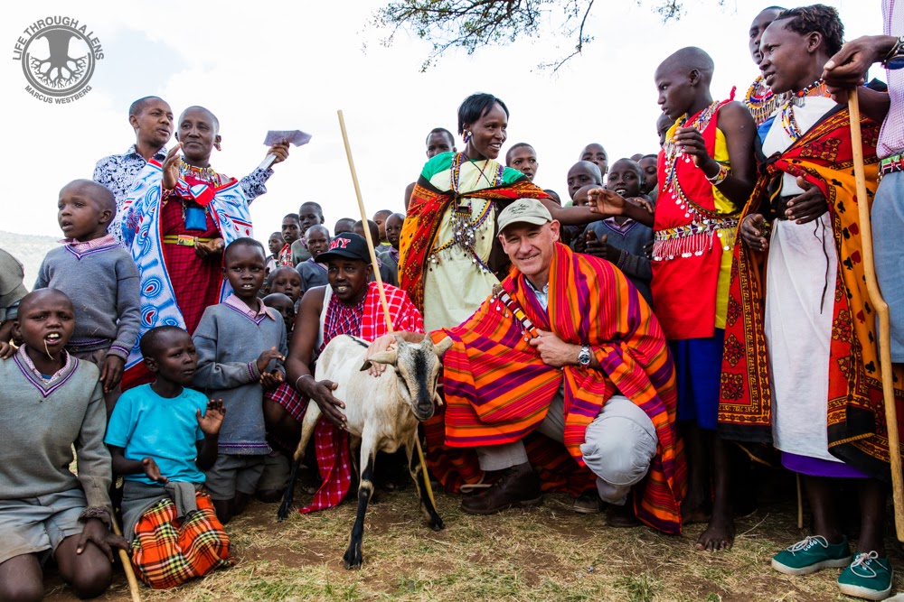 Calvin Cottar visiting a Maasai community during a traditional cultural ceremony in Kenya.