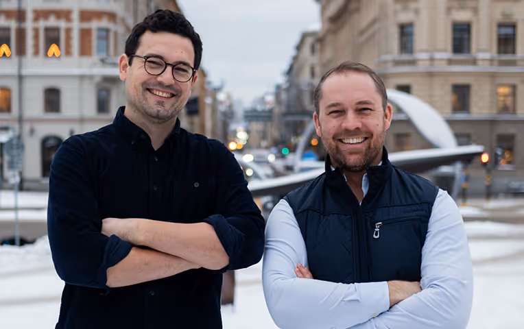 Two founders posing for photo in Europe