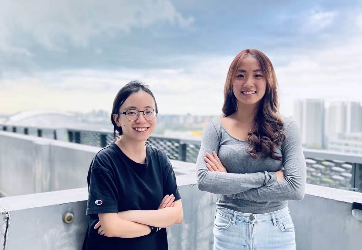 two female founders outside a building