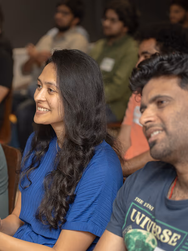 Female founder sitting next to aa man