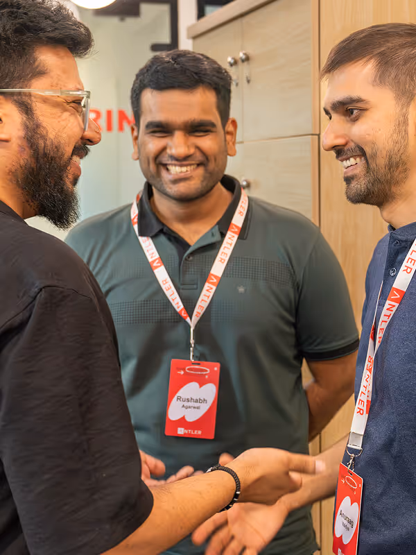 Three Antler founders with lanyards