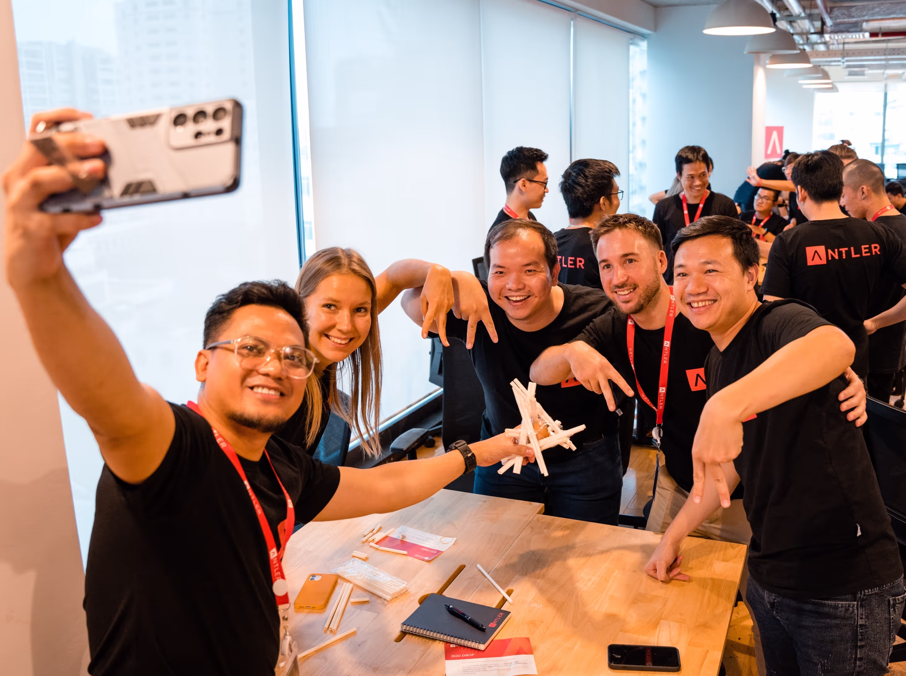 Antler founder taking selfie with rest of cohort