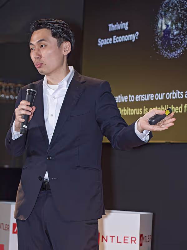 Antler founder in suit pitching