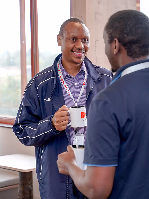 Founder holding a coffee mug