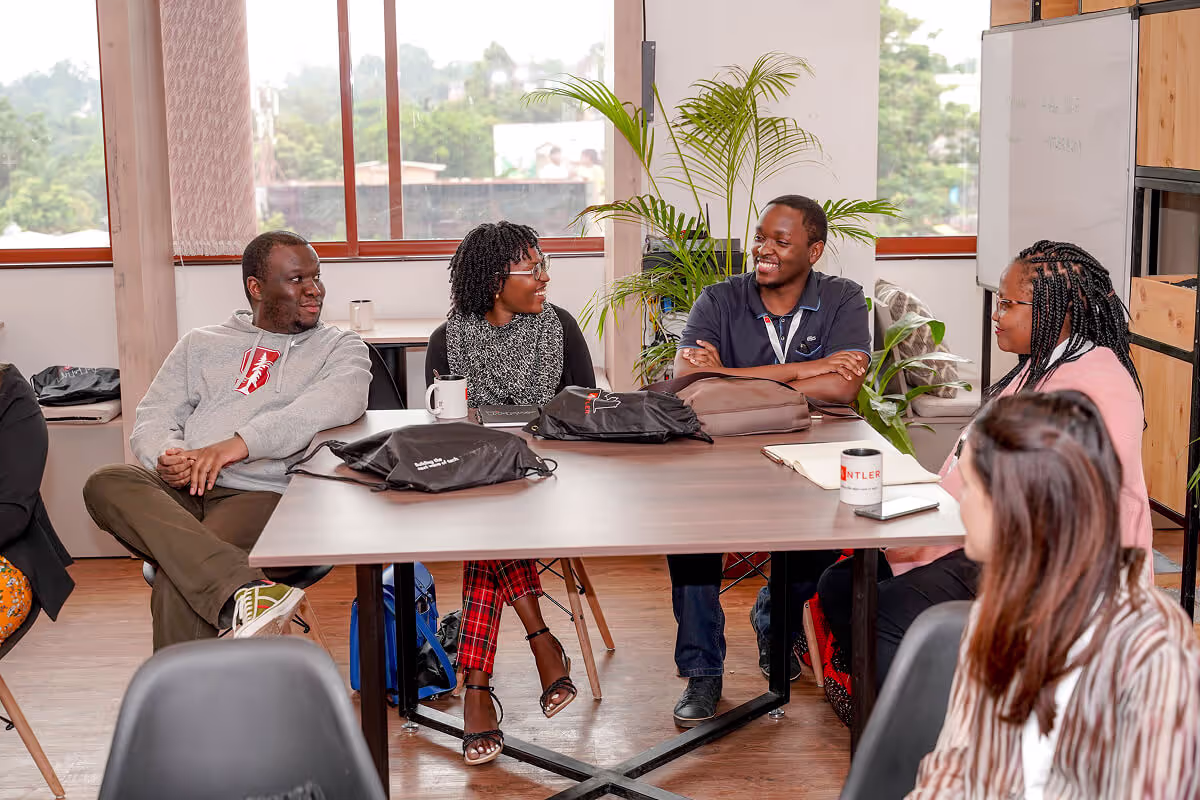 A founding team sitting around a table