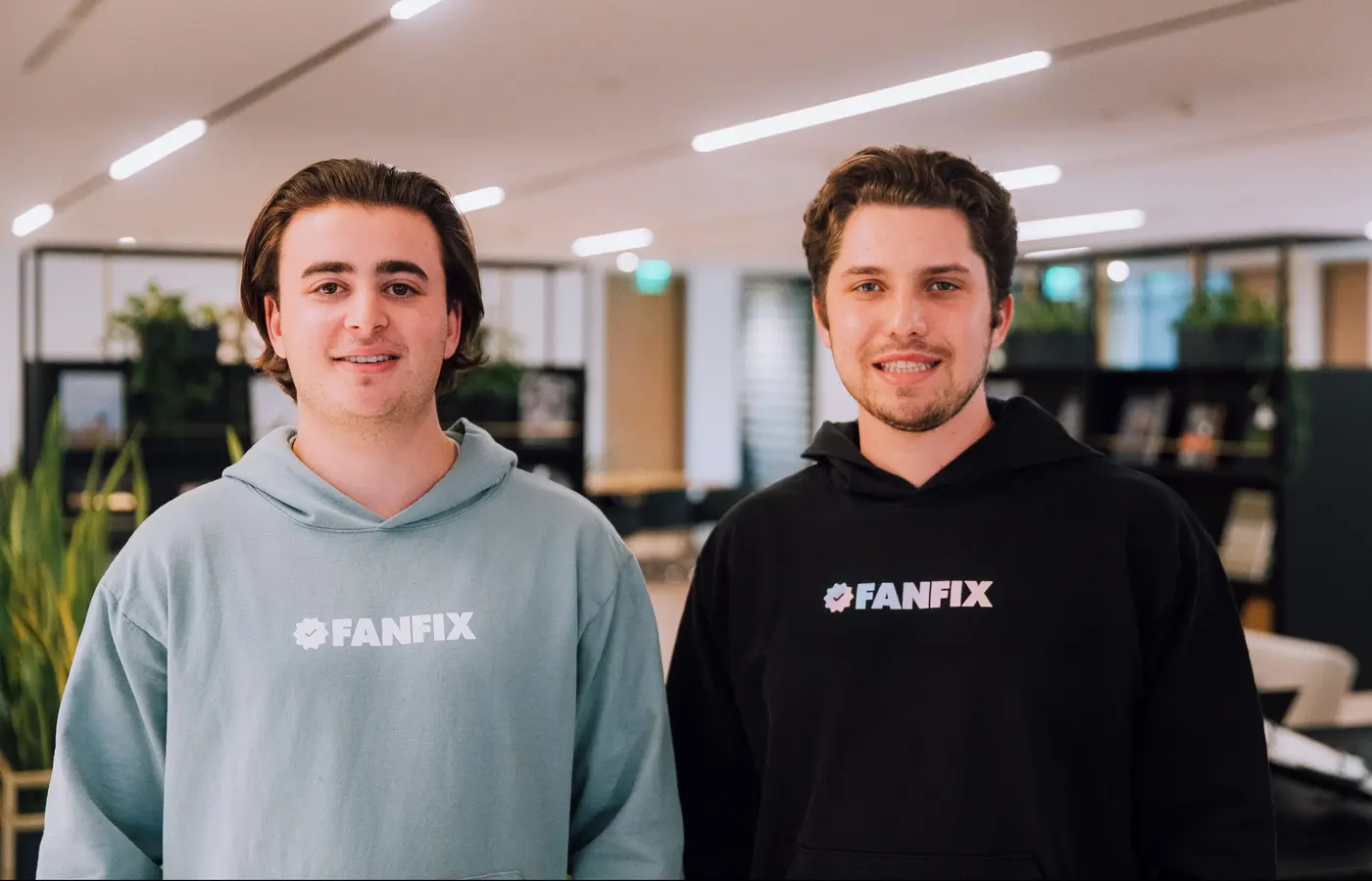 Two men wearing fanfix sweatshirts.