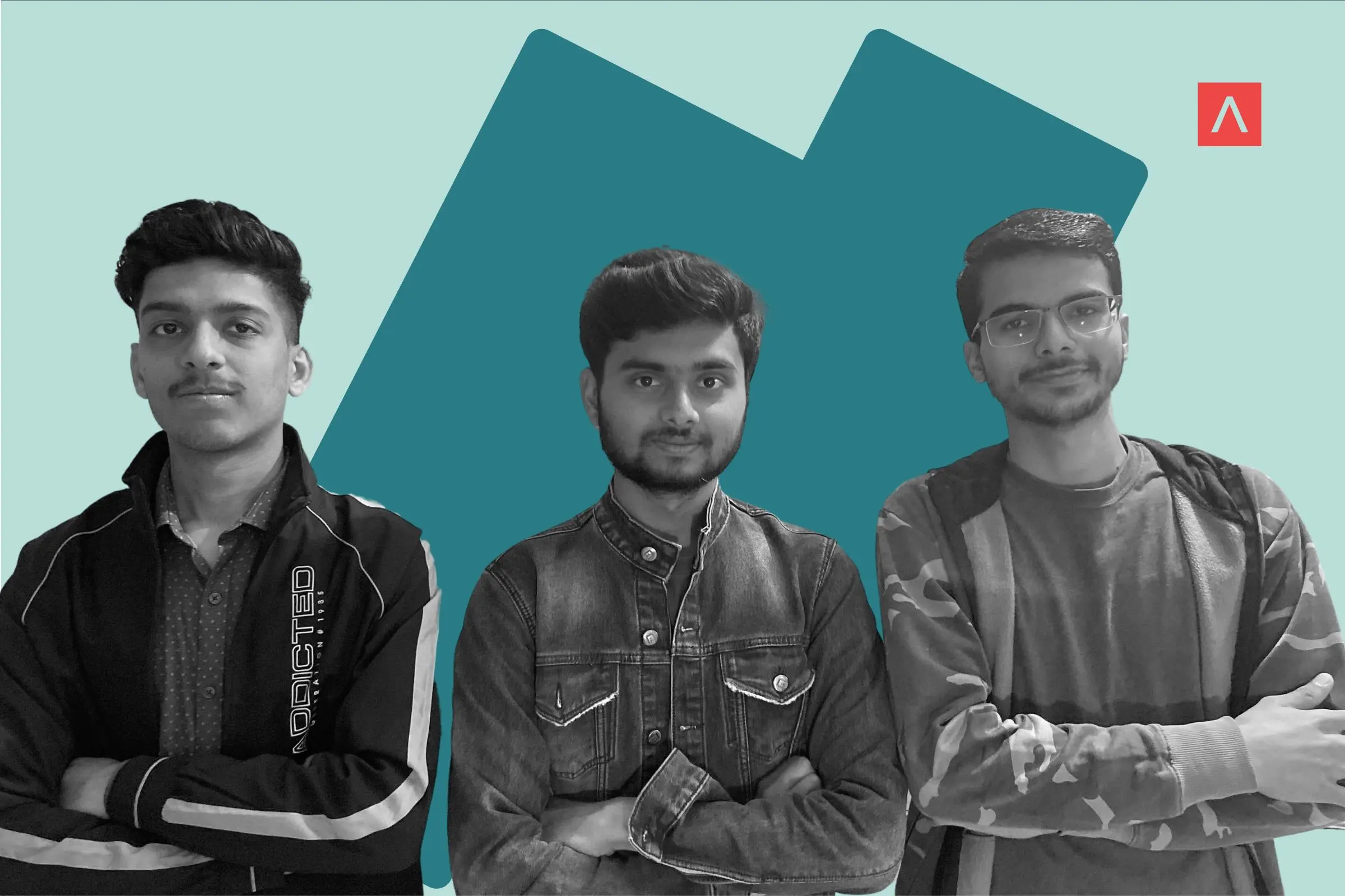 Three men standing together with their arms crossed.