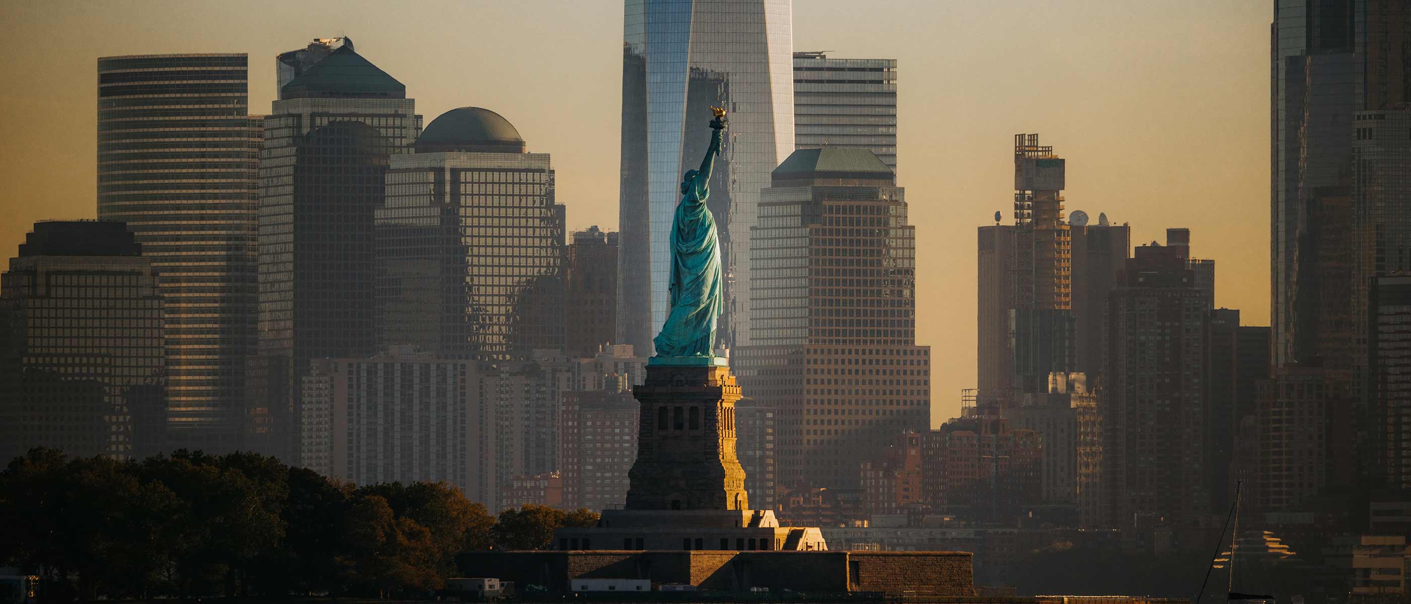 Manhattan skyline glowing at sunset over the Hudson