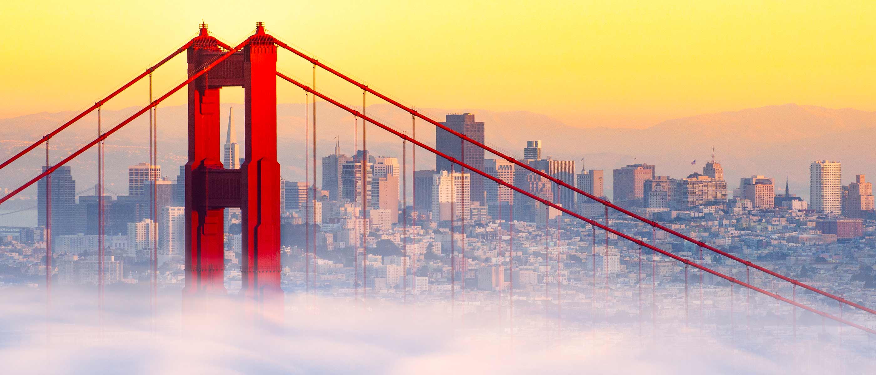 San Francisco skyline with the Golden Gate Bridge at twilight