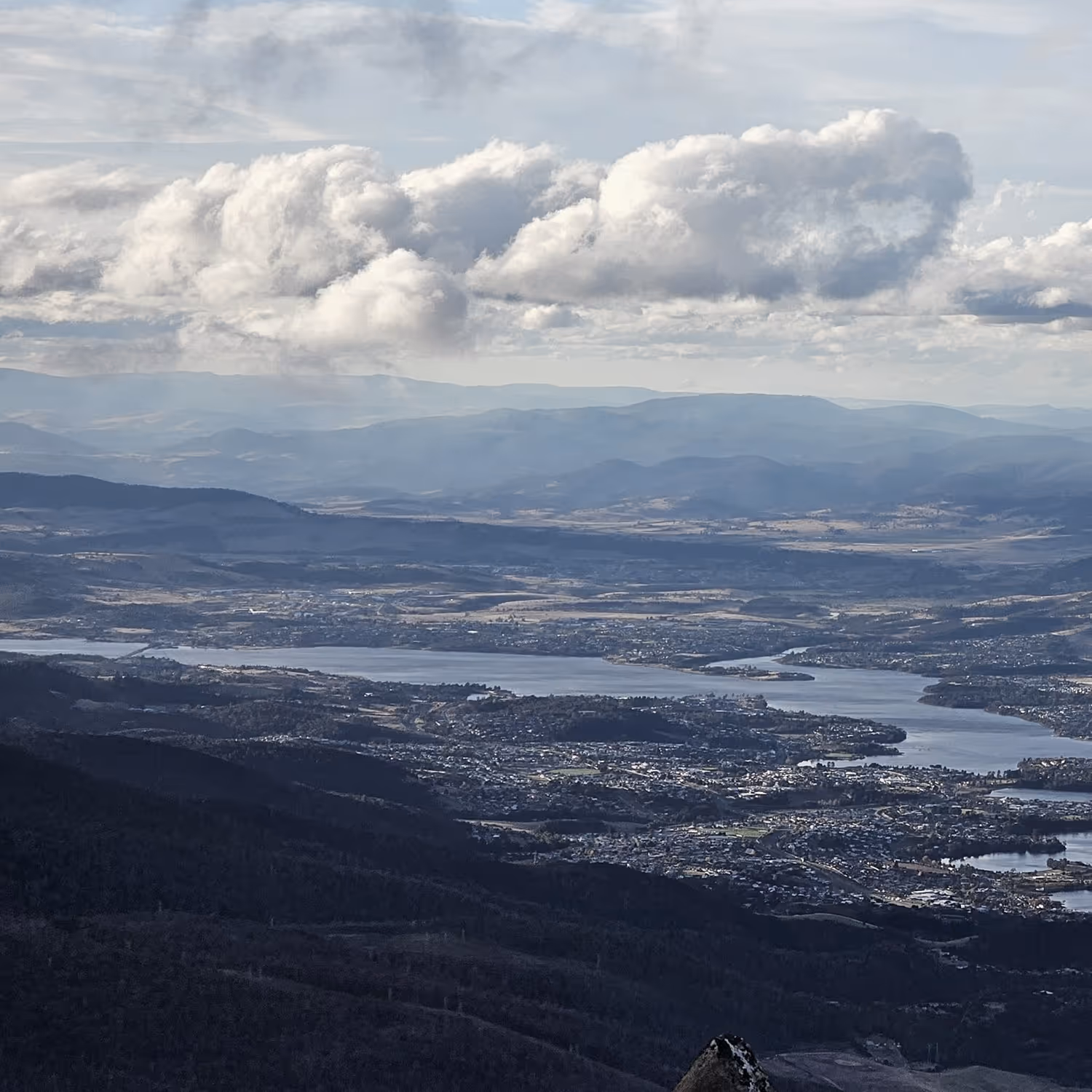 Aerial photo of mountains and houses in the distance