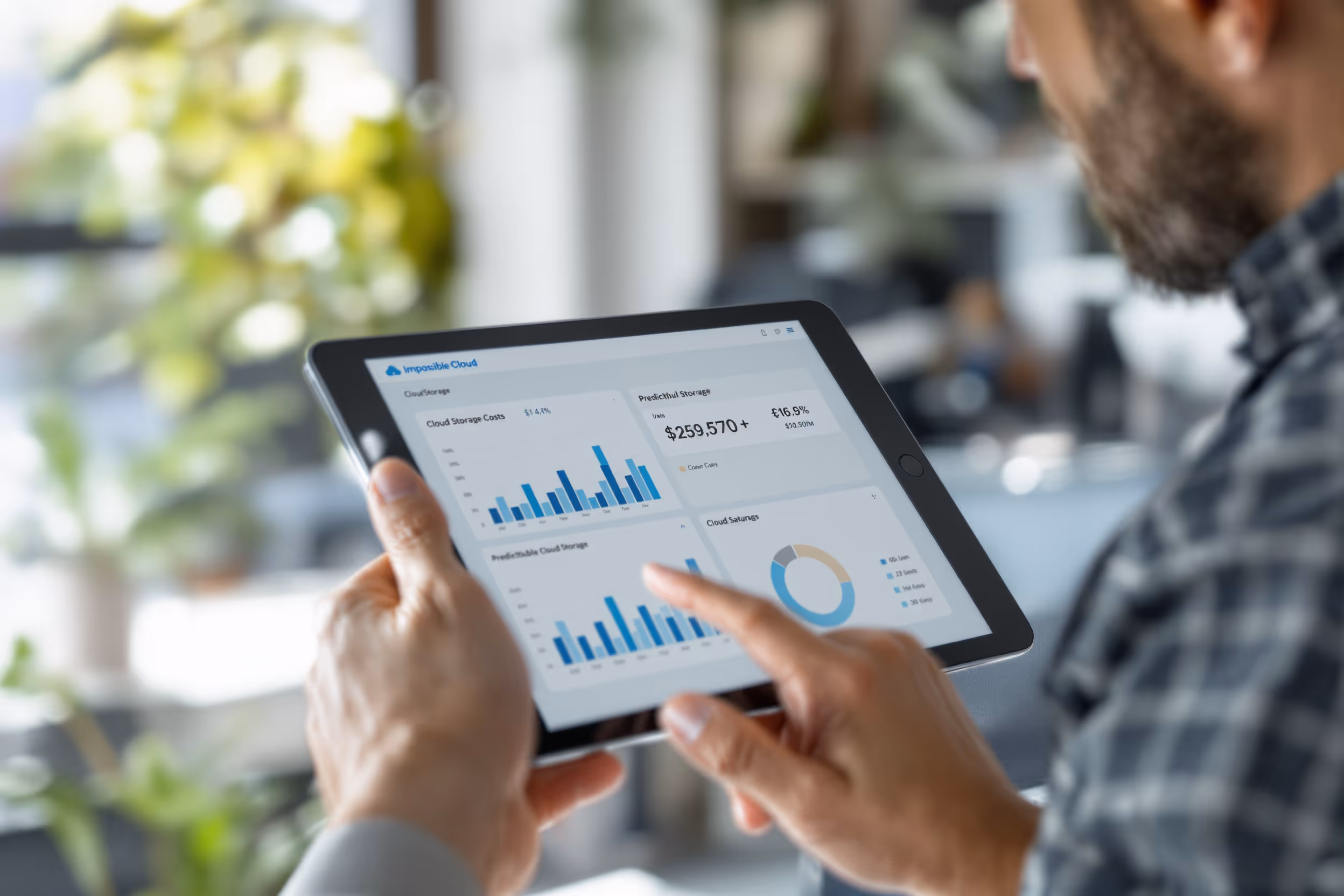 IT professional reviewing cloud storage costs and savings on a tablet.