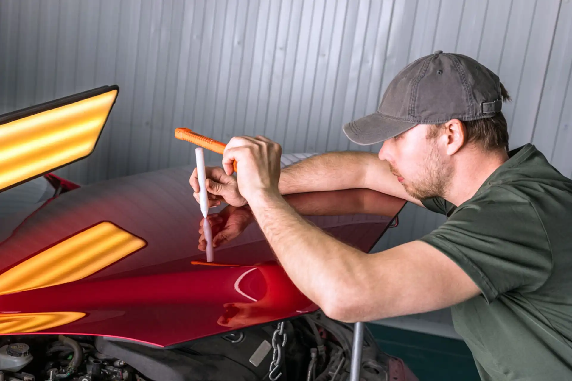 image of a car enthusiast examining a vehicle
