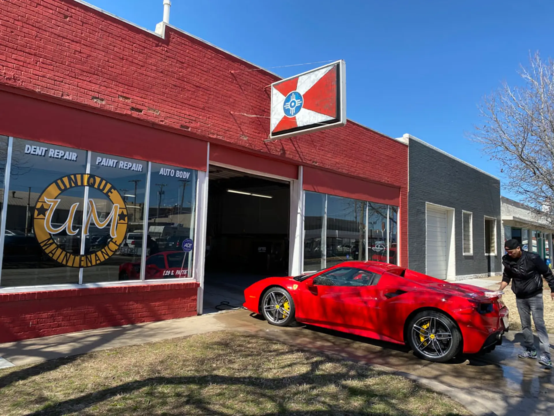 image of a car enthusiast examining a vehicle