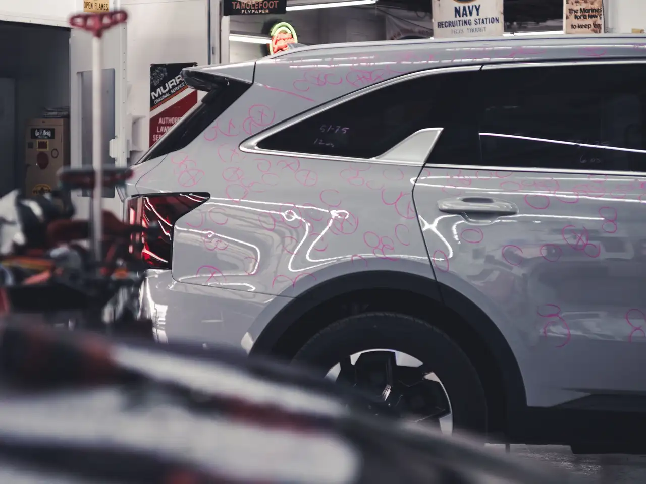 image of a car enthusiast examining a vehicle