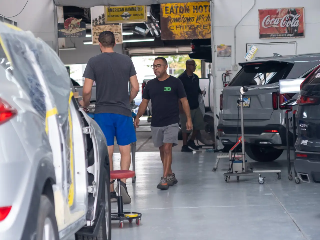 image of a car enthusiast examining a vehicle