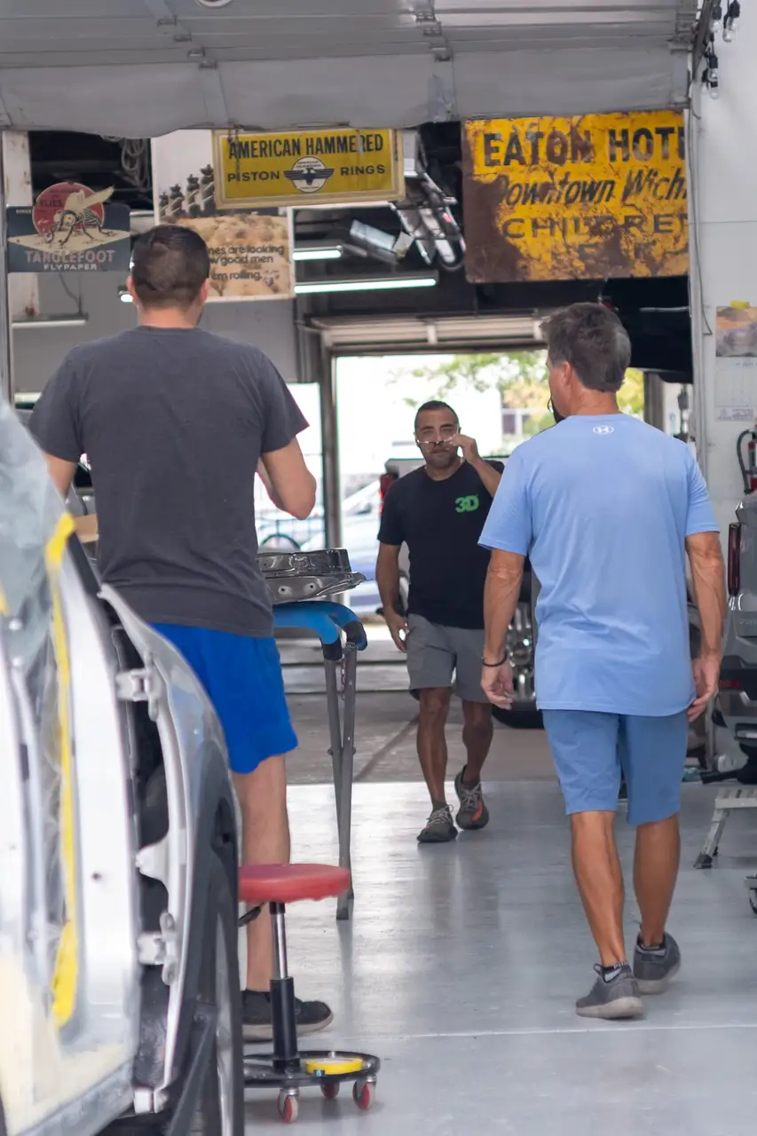 image of a car enthusiast examining a vehicle