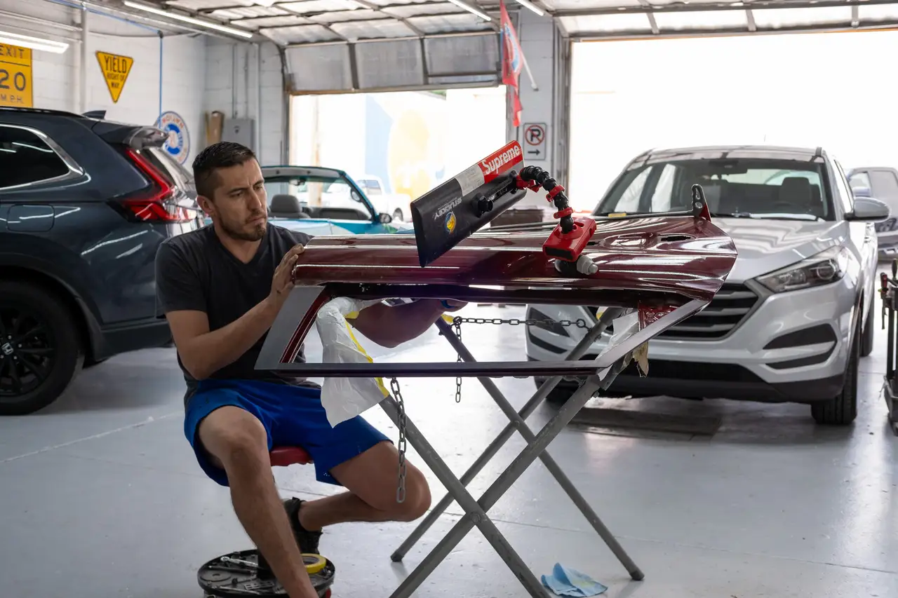 image of a car enthusiast examining a vehicle