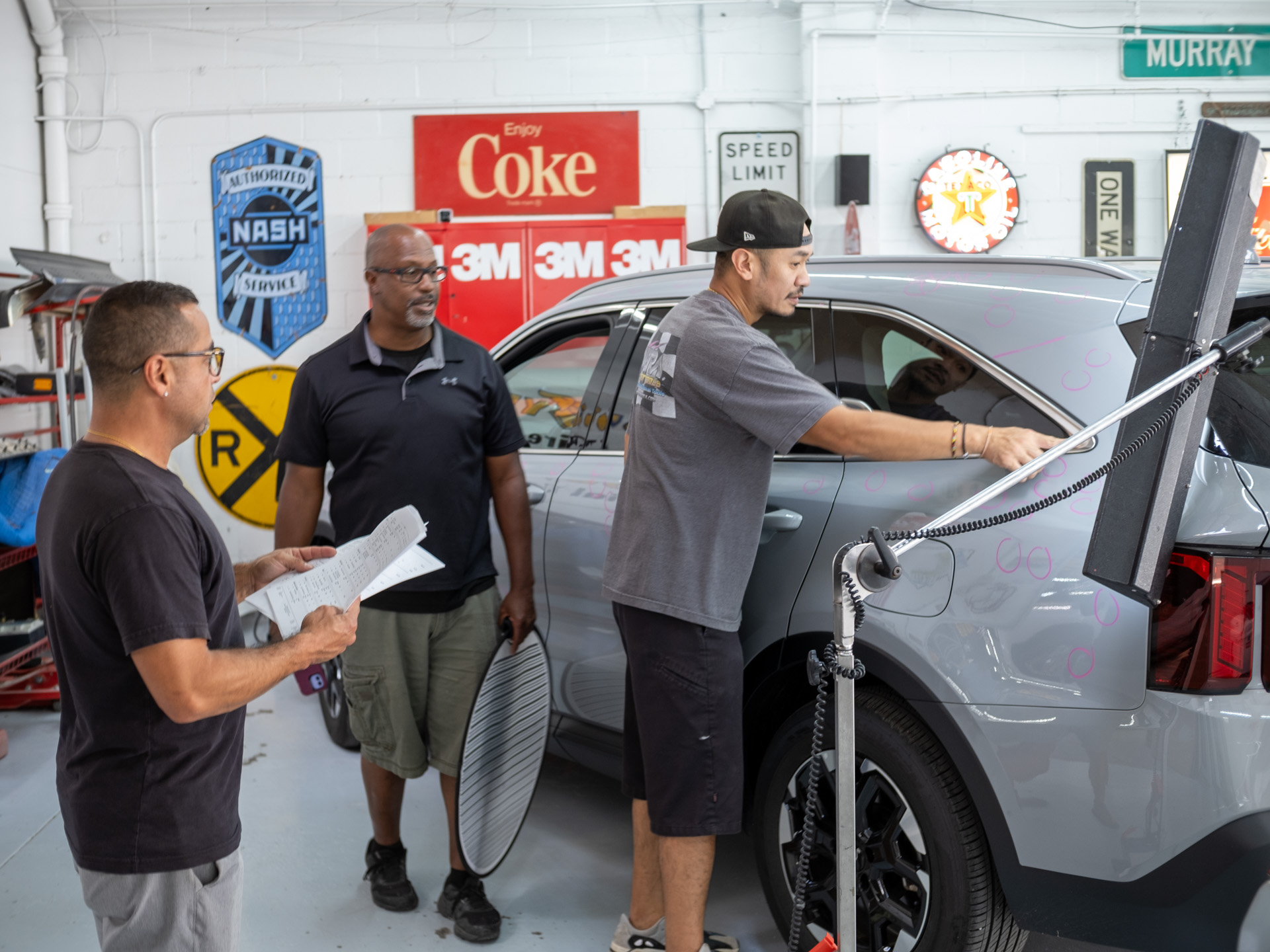 image of a car enthusiast examining a vehicle