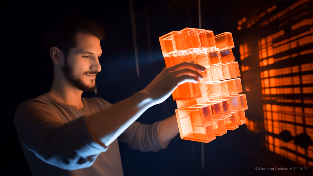A man rearranging glowing orange cubes.