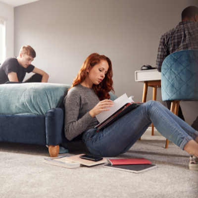 Students in their shared house relaxing