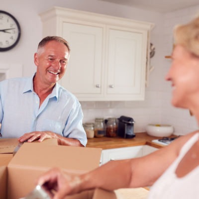 Elderly couple with moving boxes