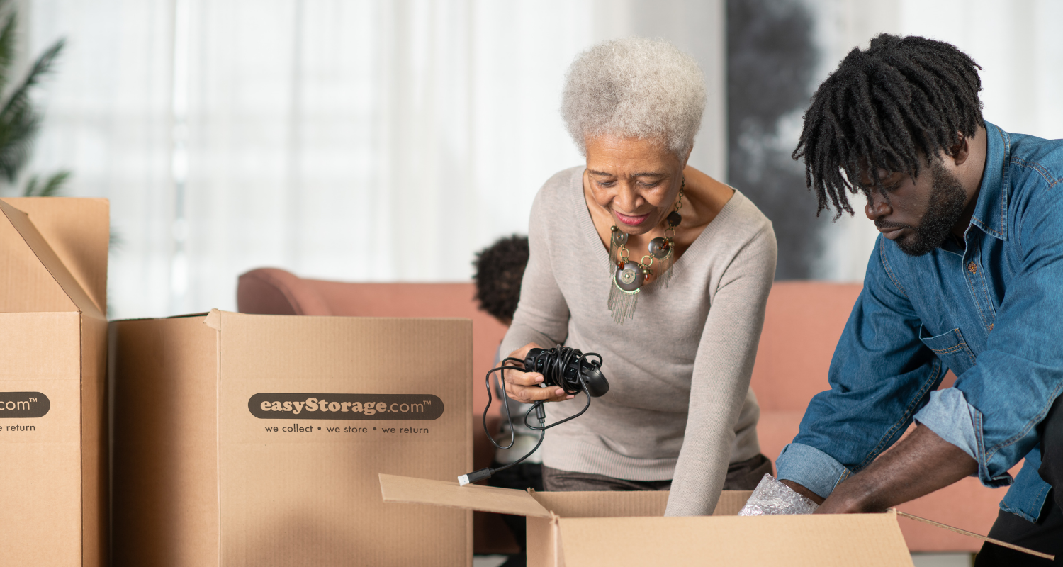 Older woman and younger man unpacking easyStorage moving boxes