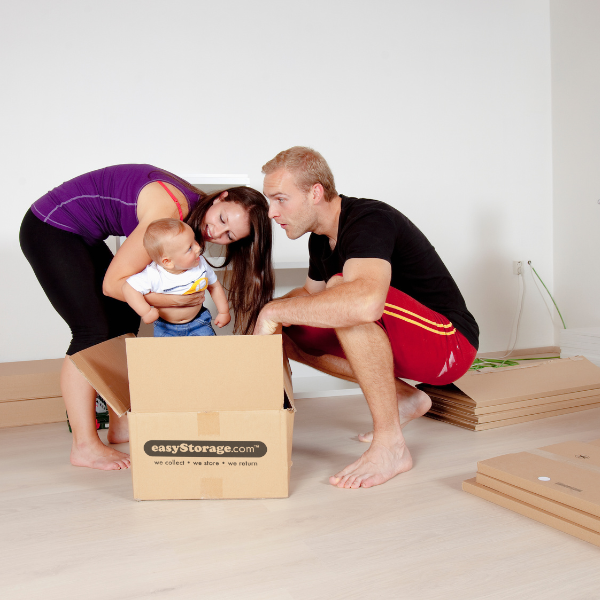 Parents playing with baby in easyStorage Boxes