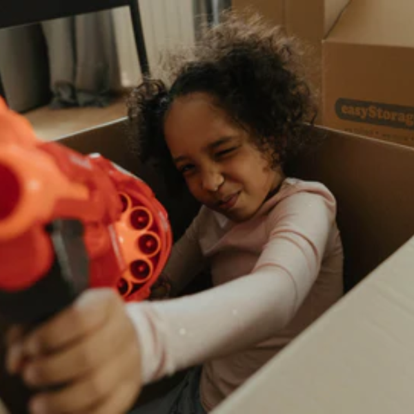 Child playing with toys around easyStorage Boxes
