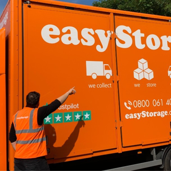 London North East easyStorage franchisee Kristof pointing at the van