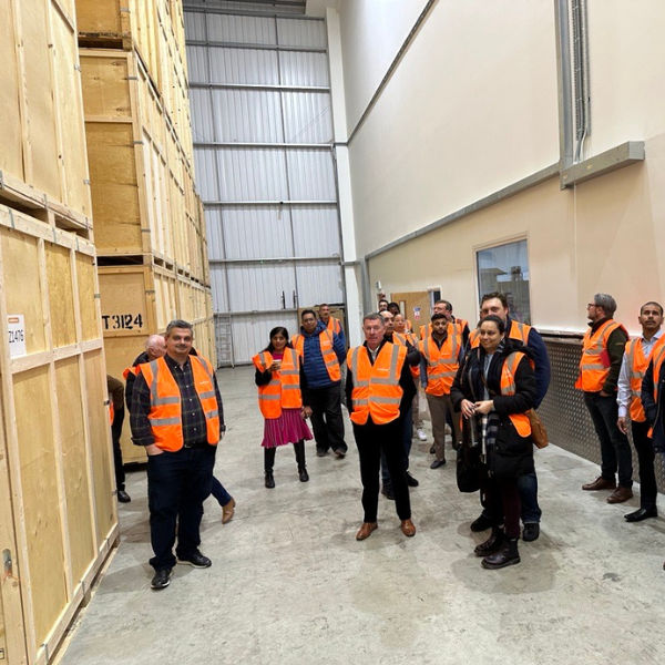 A group of prospective franchisees in the storage facility