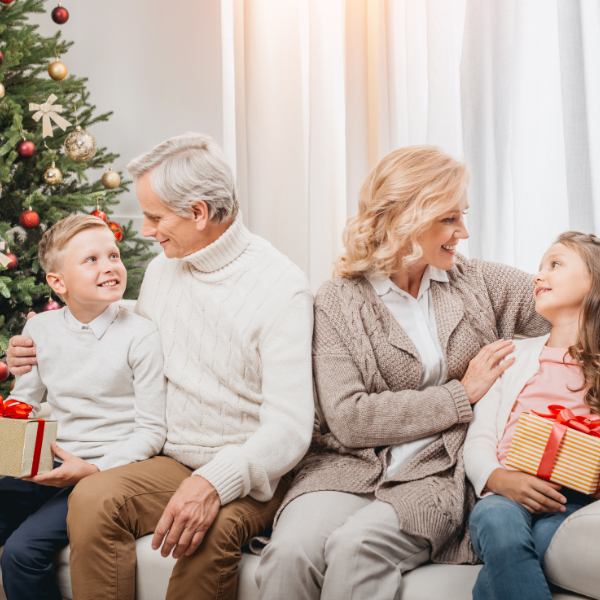 grandparents giving grandchildren Christmaspresents 