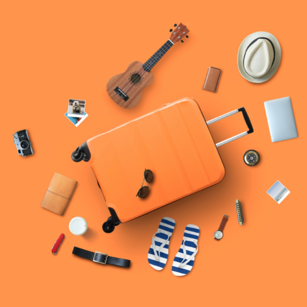 An orange suitcase with holiday essentials ready to be packed