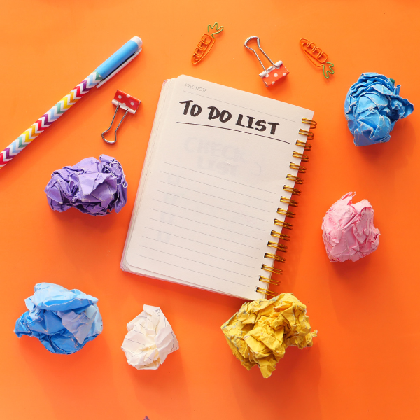 A notebook with to do list written on it