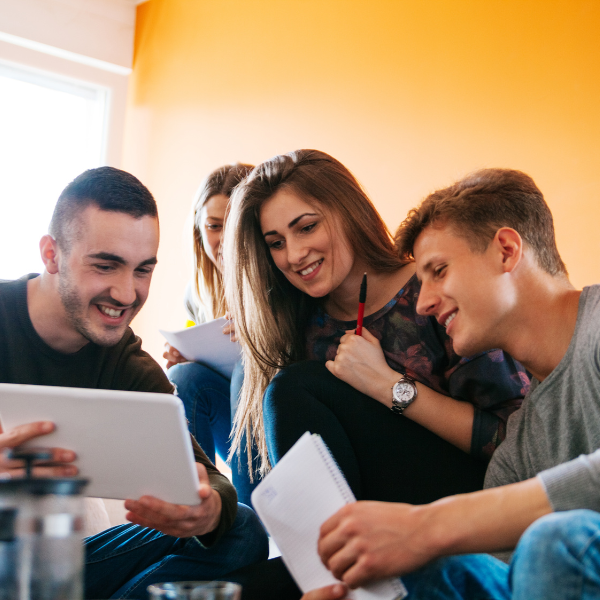 University students in student accommodation searching for a new house 