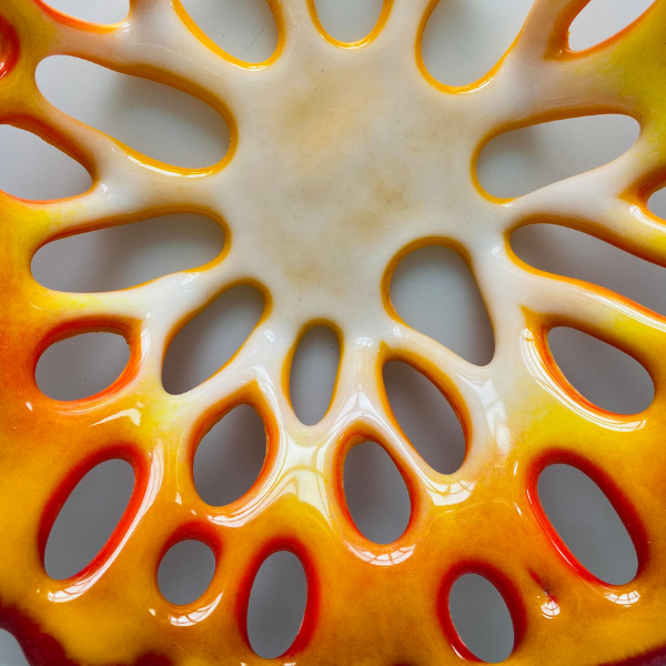 Close up of orange glass artwork