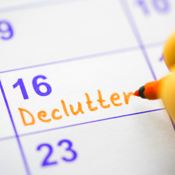 A close up of a calendar on the 16th Declutter being written in orange