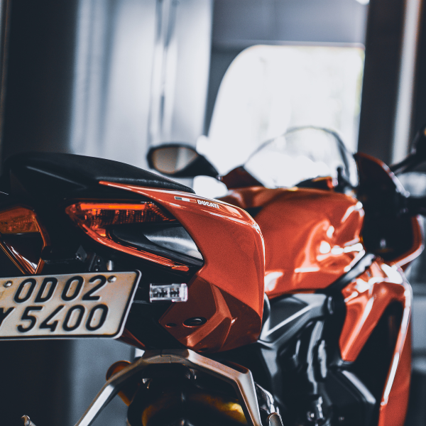 Back of orange metallic motorbike