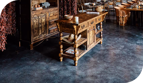Rustic wooden furniture placed on polished commercial flooring in a restaurant setting, highlighting durability and aesthetic appeal.