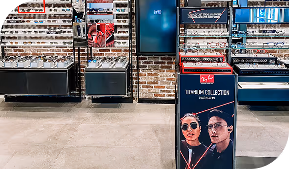 Eyewear store display featuring the Ray-Ban Titanium Collection, with modern shelving and premium commercial flooring in a retail setting.
