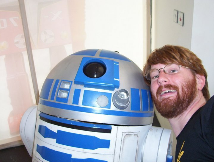 An engineer posing with R2D2