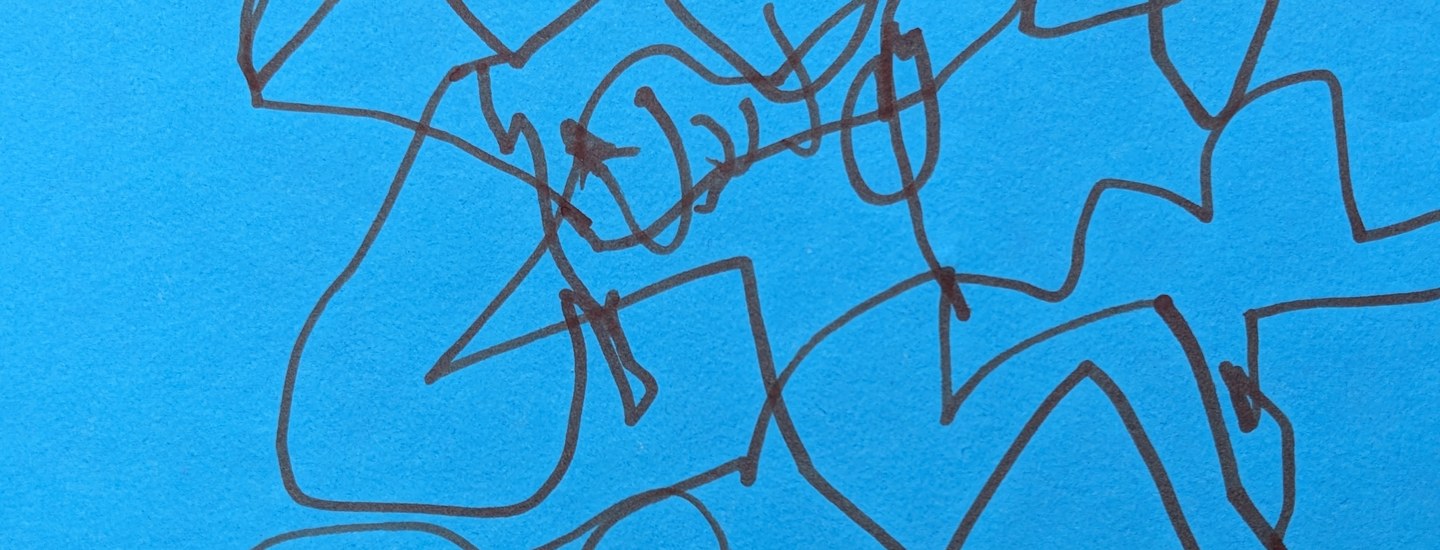 Abstract marker drawing on bright blue paper — dark looping lines cross and tangle densely across the full surface, forming an energetic, layered web of interconnected shapes.