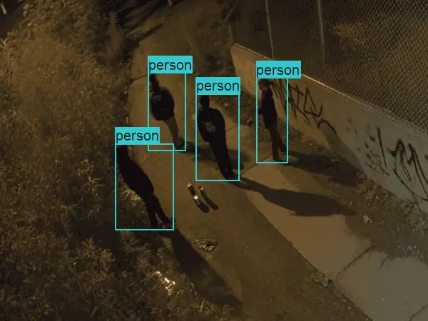 Four people inside cyan person detection boxes along a fence line at night