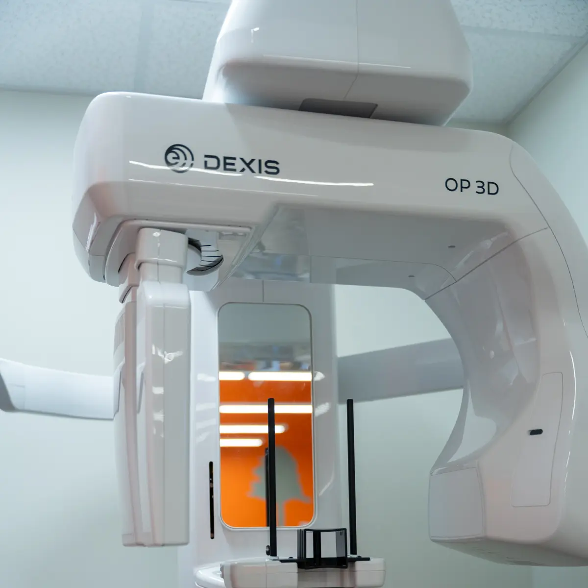 closeup of a white DEXIS dental imaging machine