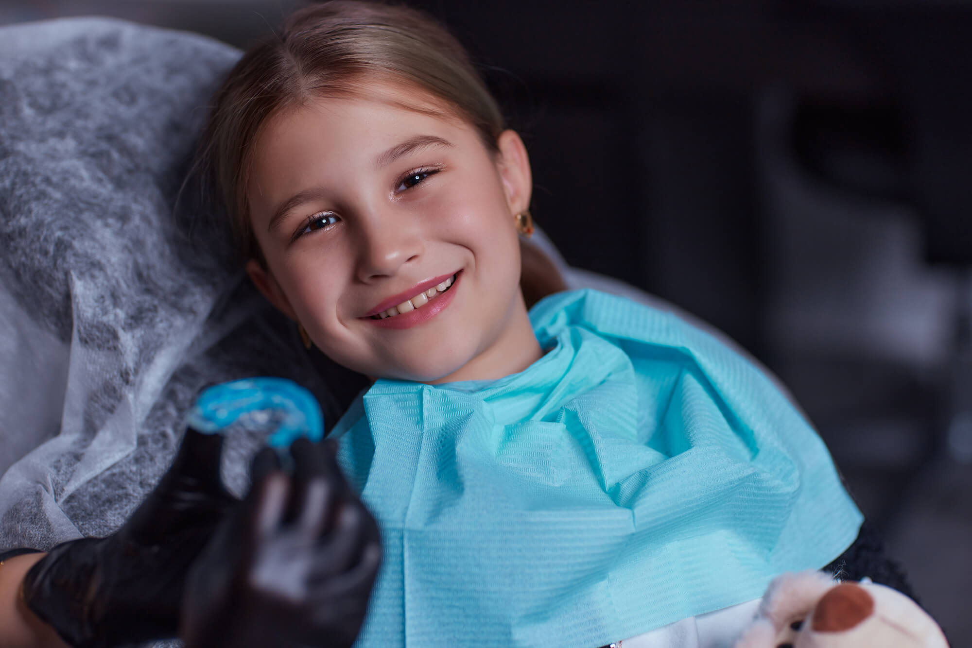 Dentist Giving a Girl Their Invisalign in Nashville