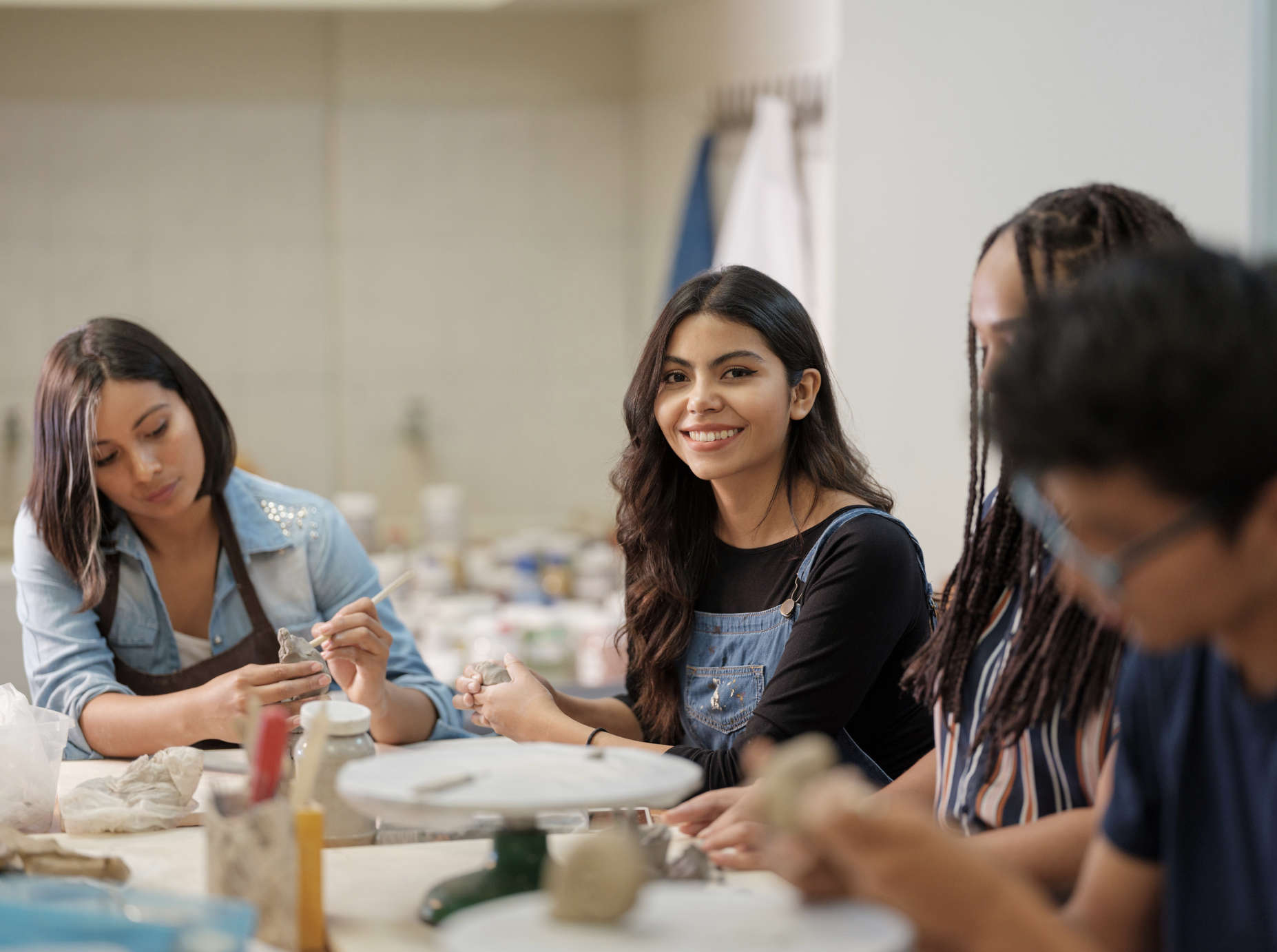 Hosts and guests enjoying a pottery class booked through ApnaKey